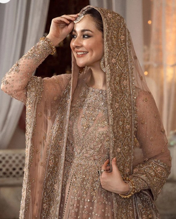 Peach pink Pakistani bridal dress with traditional handwork