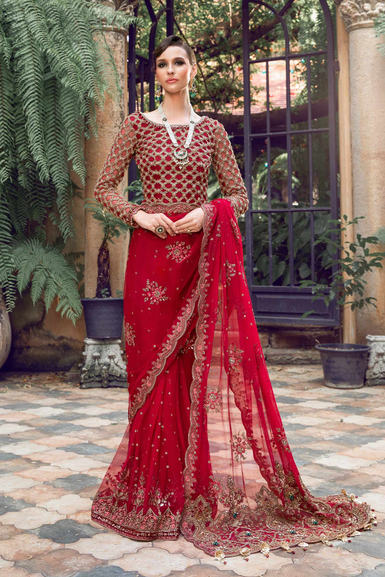 Red outfit with floral embroidery and hand embellishments