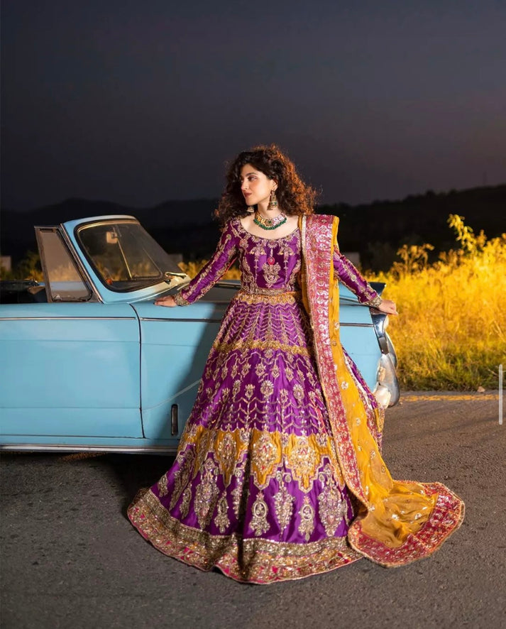 Ahmad Sultan Adaa purple and yellow bridal ensemble