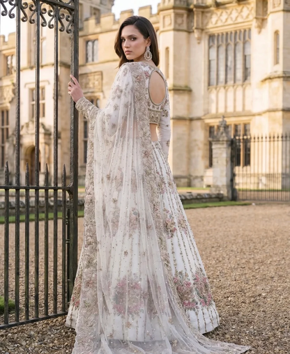 White Tiara lehenga with pink, magenta and champagne floral embroidery