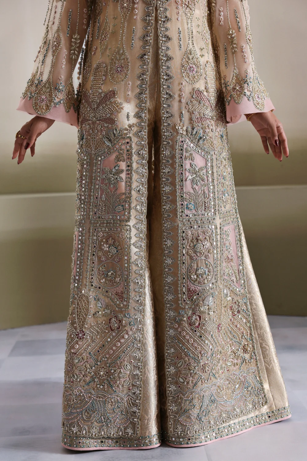 Beige Pakistani wedding outfit with embroidery