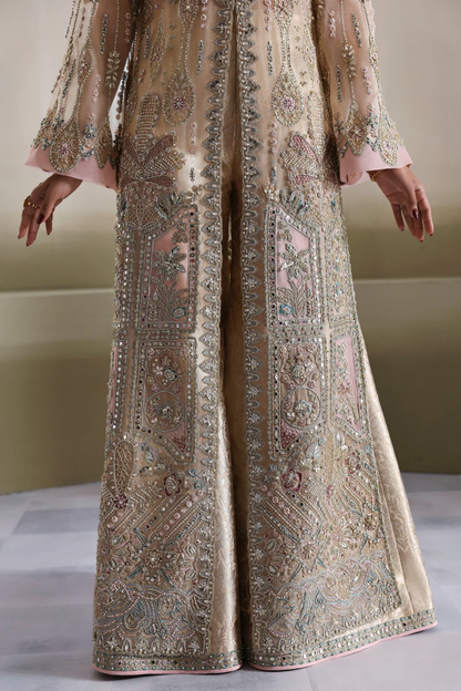 Beige Pakistani wedding outfit with embroidery