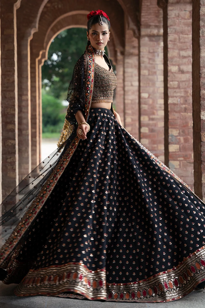 Black formal ensemble with multicoloured embroidery