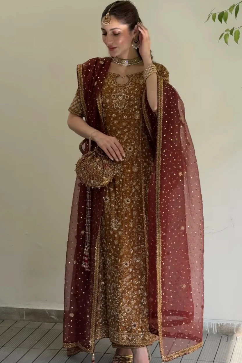 Caramel-rust shirt featuring intricate gold tilla embroidery