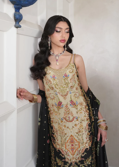 Champagne-gold trousers paired with a black embroidered dupatta