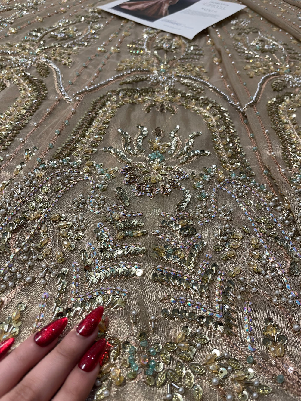 Champagne gold formal gown with intricate embroidery