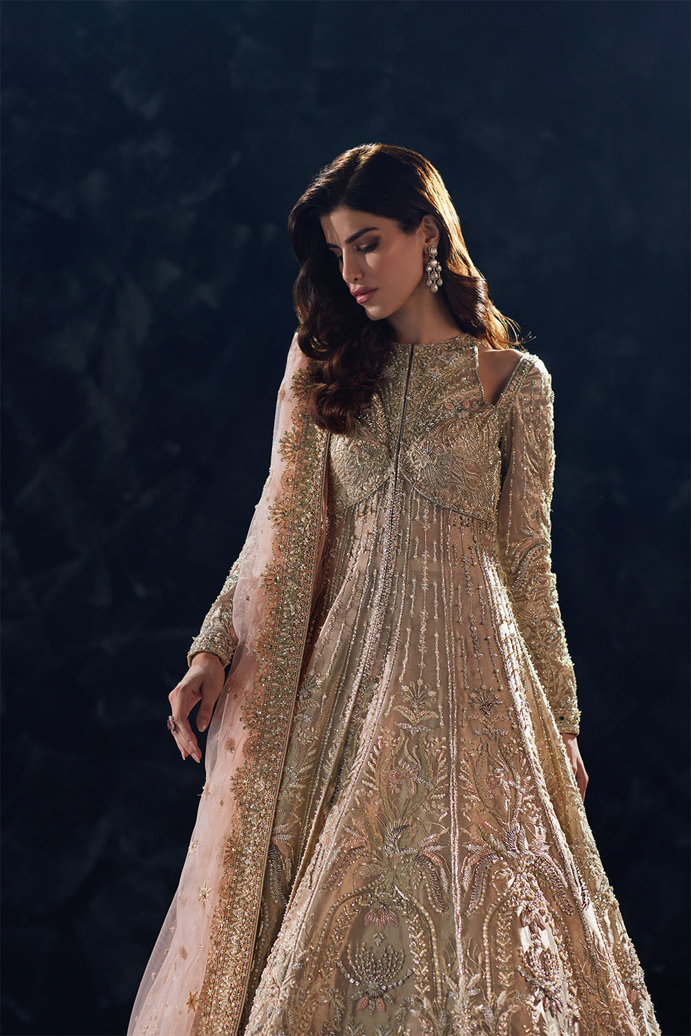 Champagne gold flared gown with hand embellishment