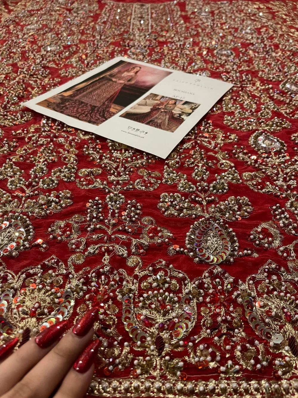 Faiza Saqlain crimson bridal outfit worn by Hania Aamir