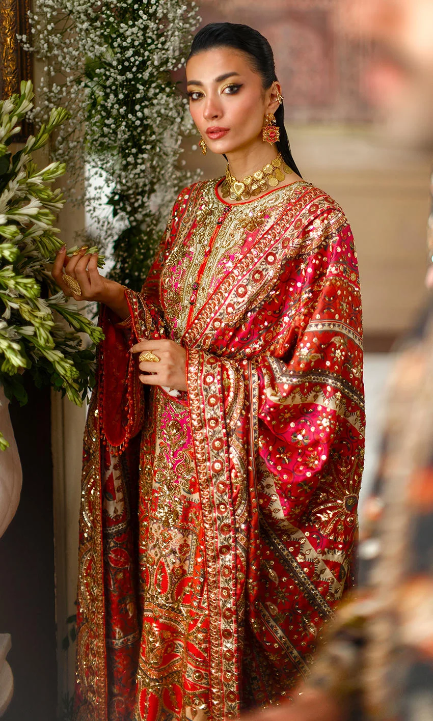 Crimson Pakistani formal wear with intricate embroidery