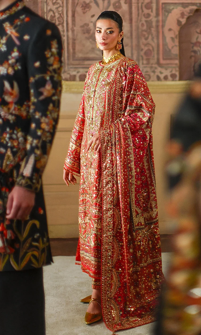Crimson red ensemble with gold hand embellishment