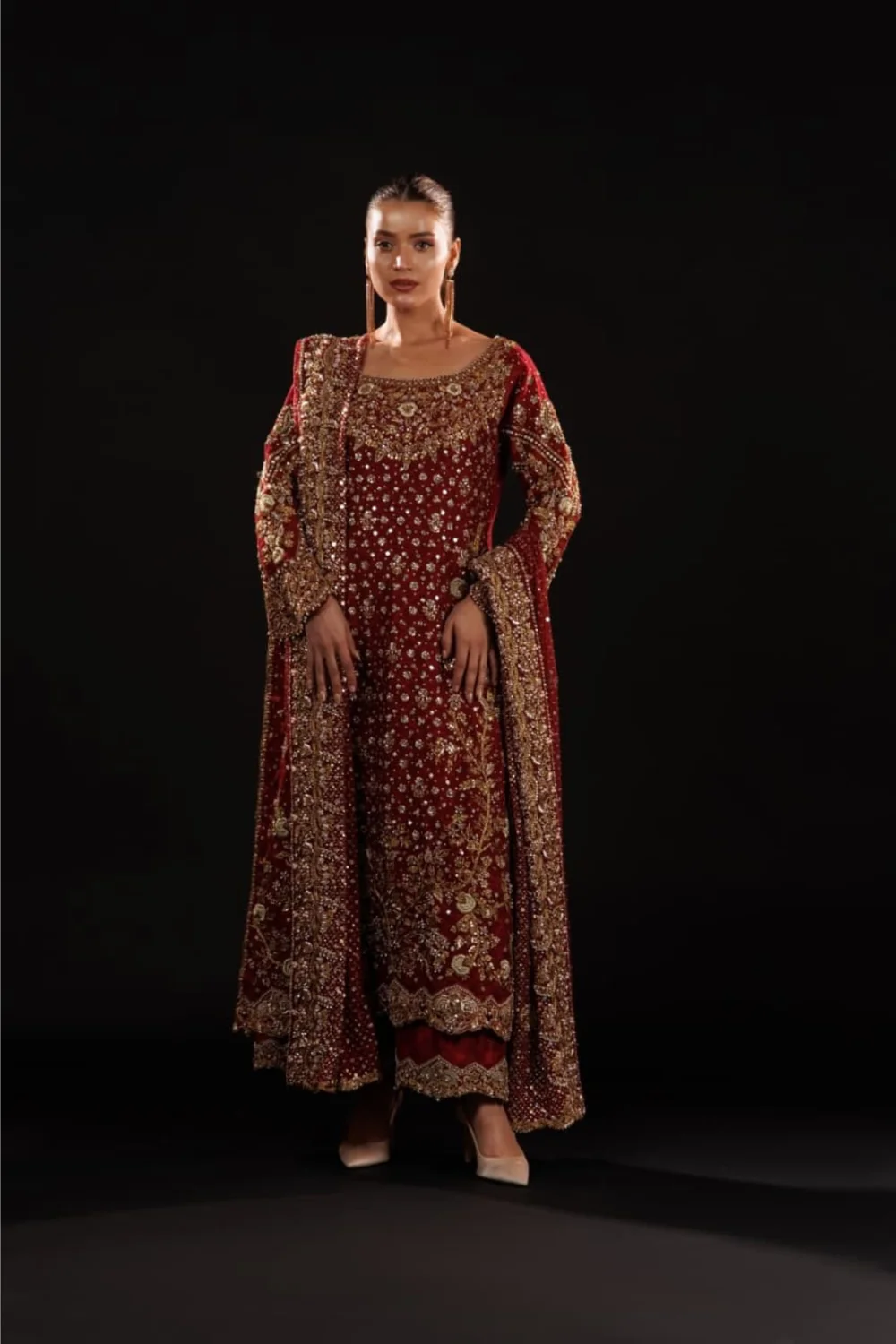 Deep crimson outfit with gold and silver handwork