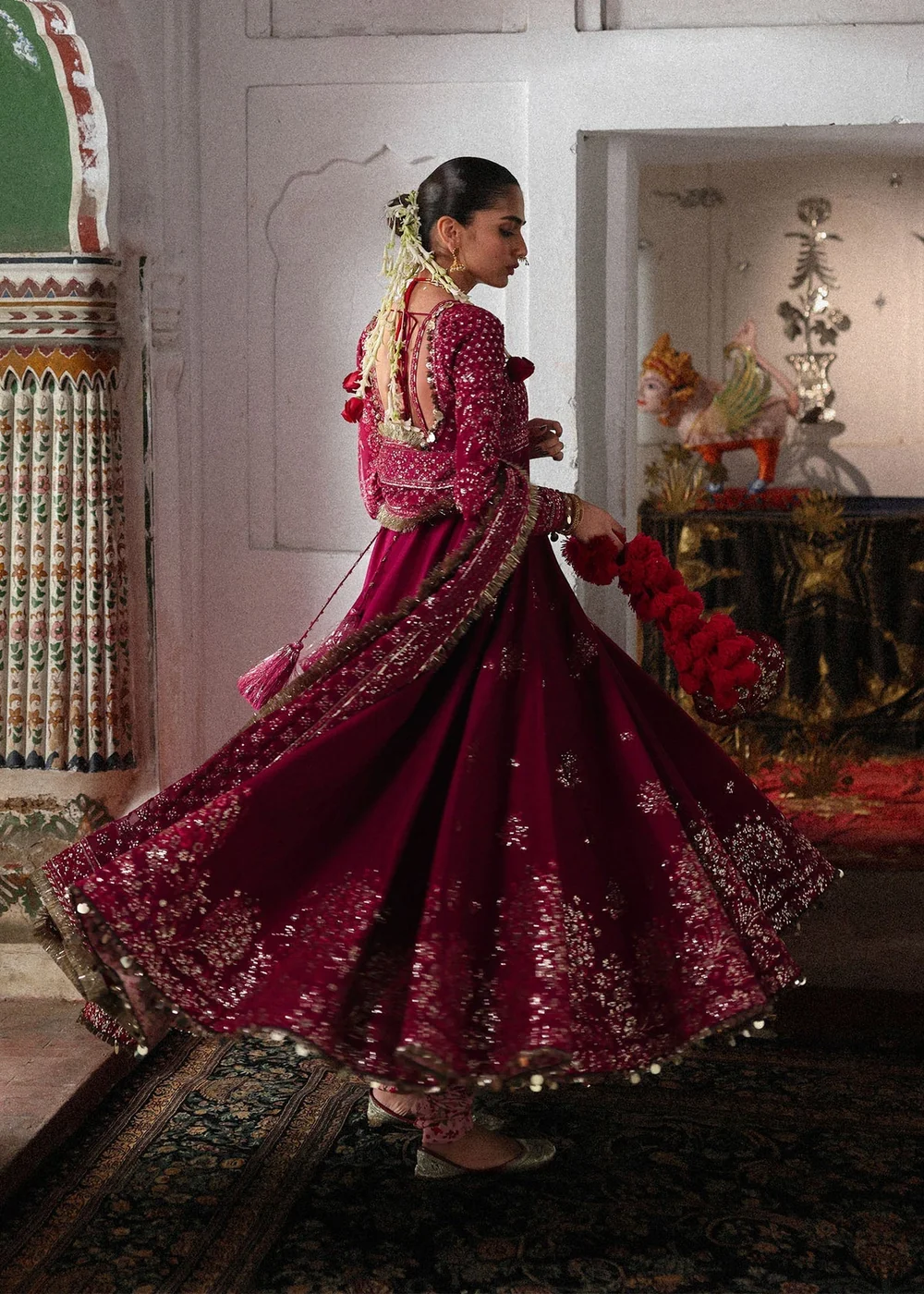 Magenta embroidered silk skirt with floral motifs