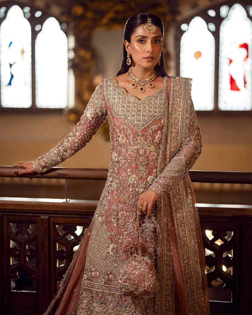 Faiza Saqlain Amari bridal ensemble with embellished potli bag