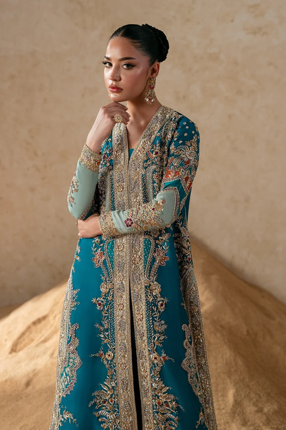 Deep teal flared jacket with ornate embroidered borders and hem