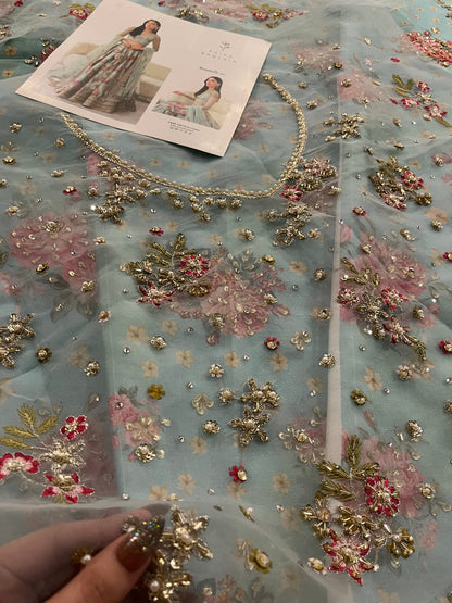 Mint green floral wedding outfit with embellished detailing
