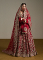 Red Pakistani bridal outfit with hand embellishments