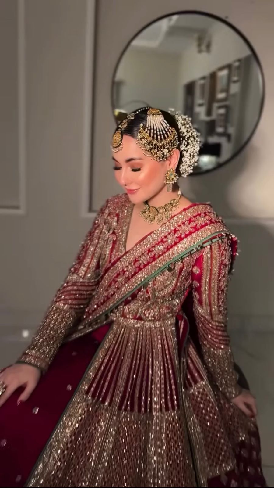 Emerald green Pakistani bridal outfit with intricate adda work