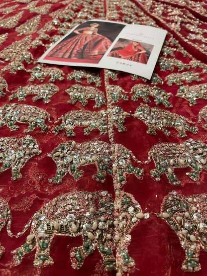 Deep red bridal lehenga with embellished dupatta