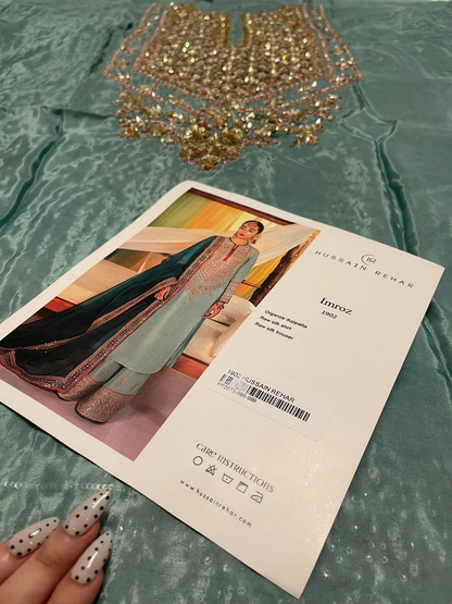 Pakistani wedding guest dress with hand embroidery and sequins