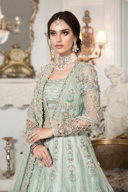 Mint green Pakistani bridal lehenga with multicoloured embroidery