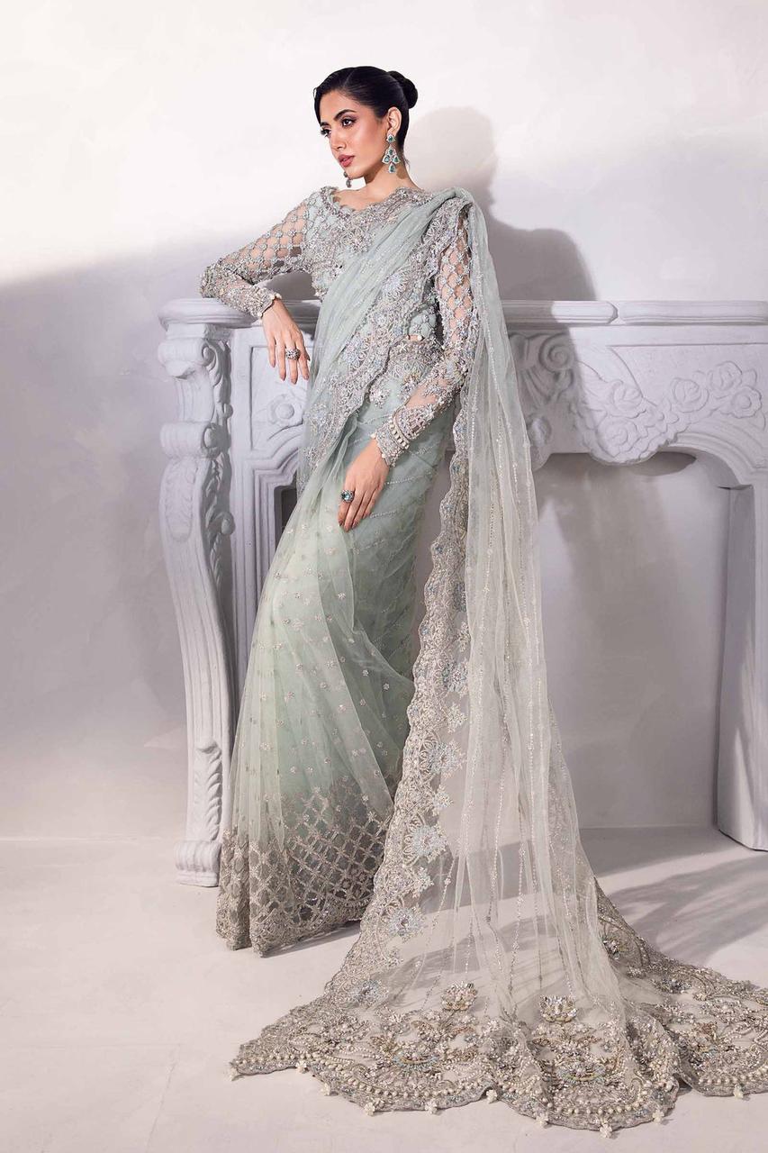 Sage green Pakistani embroidered saree with silver detailing