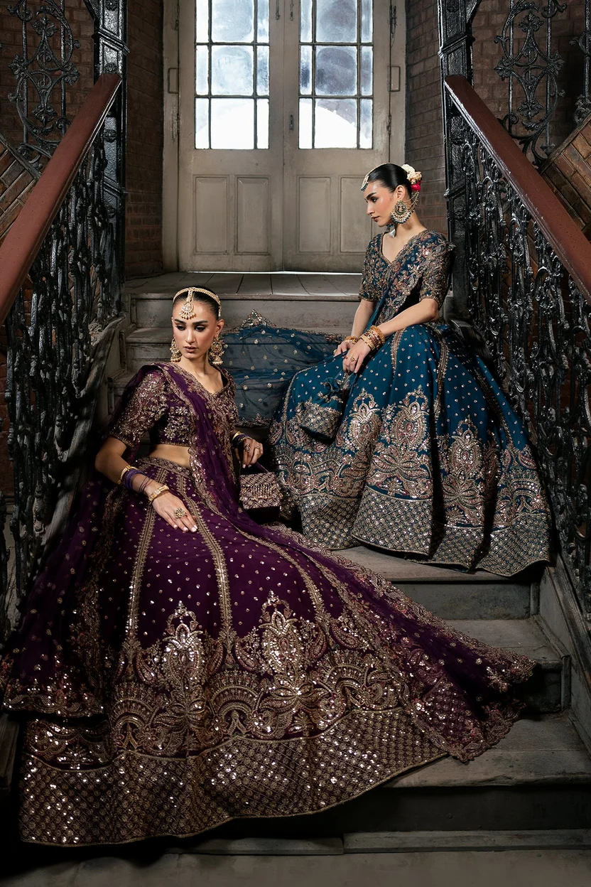 Deep teal bridal lehenga with ornate gold embroidered hem