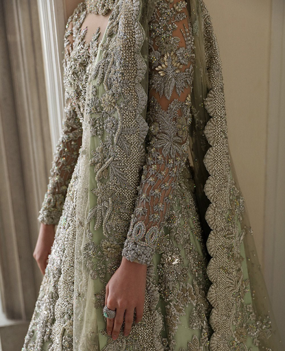 Pistachio green dress with intricate floral embroidery