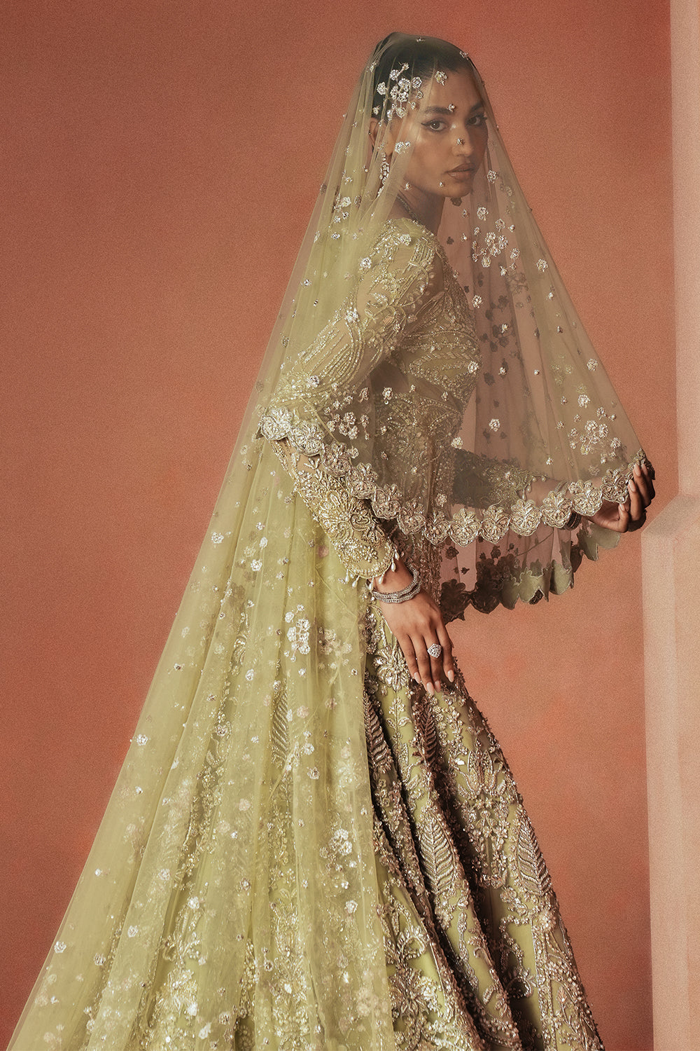 Pistachio green embellished floor length bridal gown