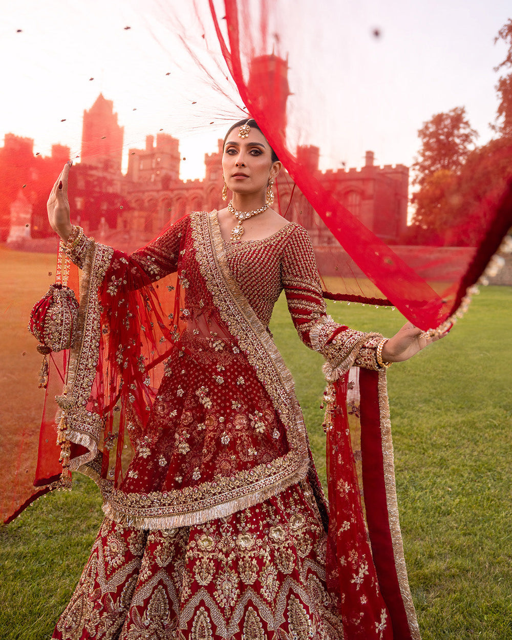 Red Pakistani bridal lehenga with gold handwork