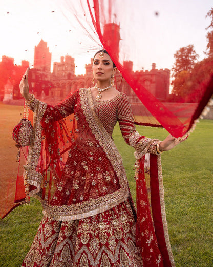 Red Pakistani bridal lehenga with gold handwork