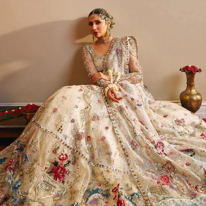 Rano bridal outfit featuring intricate silver and gold hand embellishments