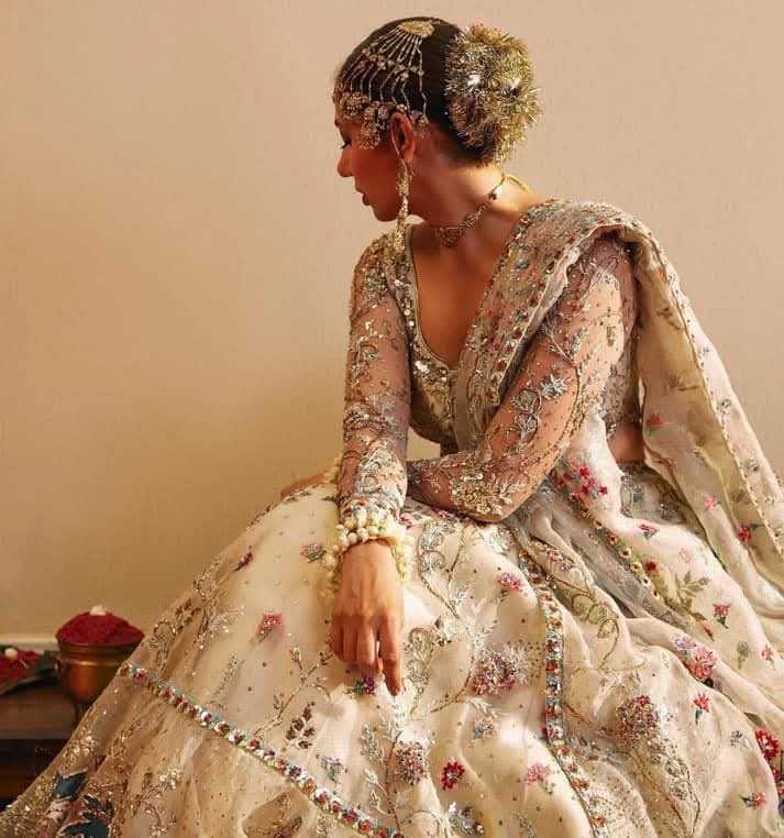 Close-up of floral embroidery and metallic threadwork on Rano lehenga