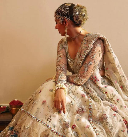 Close-up of floral embroidery and metallic threadwork on Rano lehenga