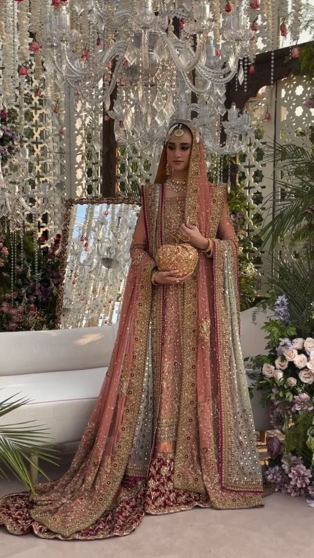 Rose peach bridal outfit with intricate handwork