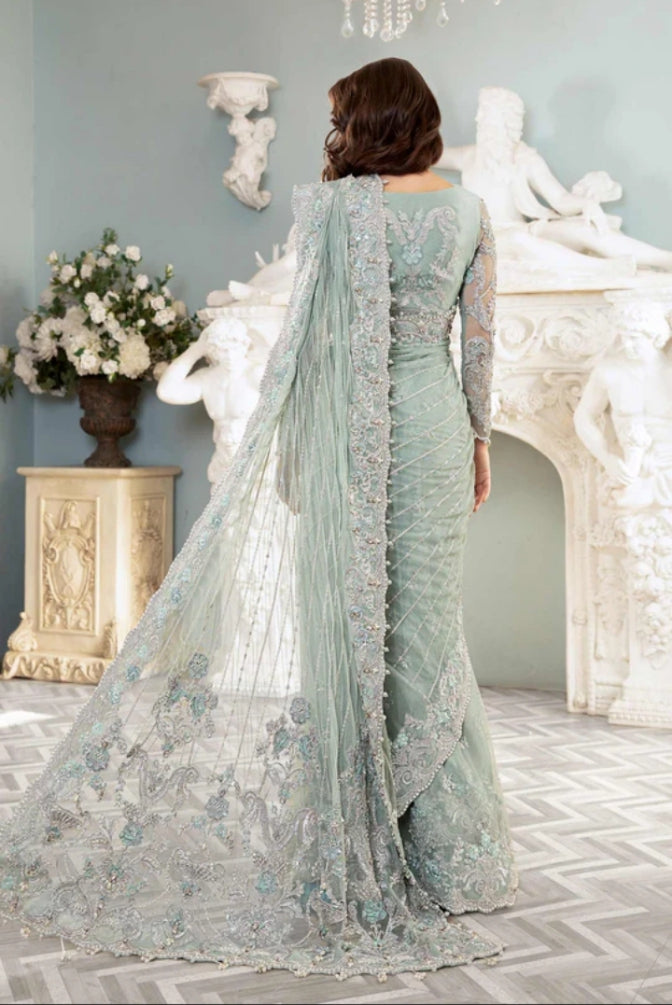 Sage green saree with detailed embroidered border