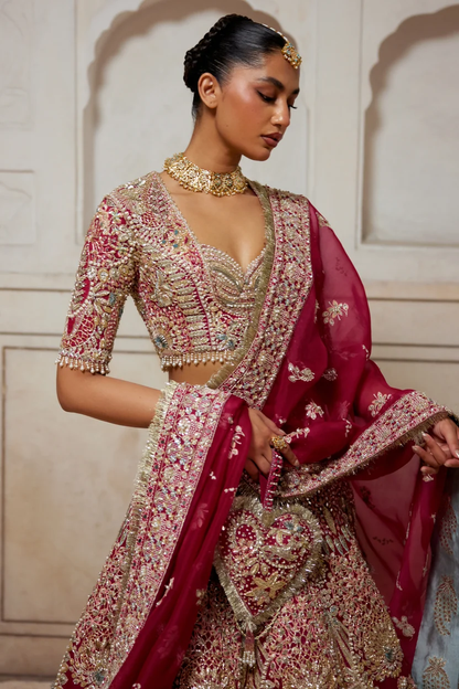 Diyar bridal lehenga with ornate paisley motifs and layered hem borders