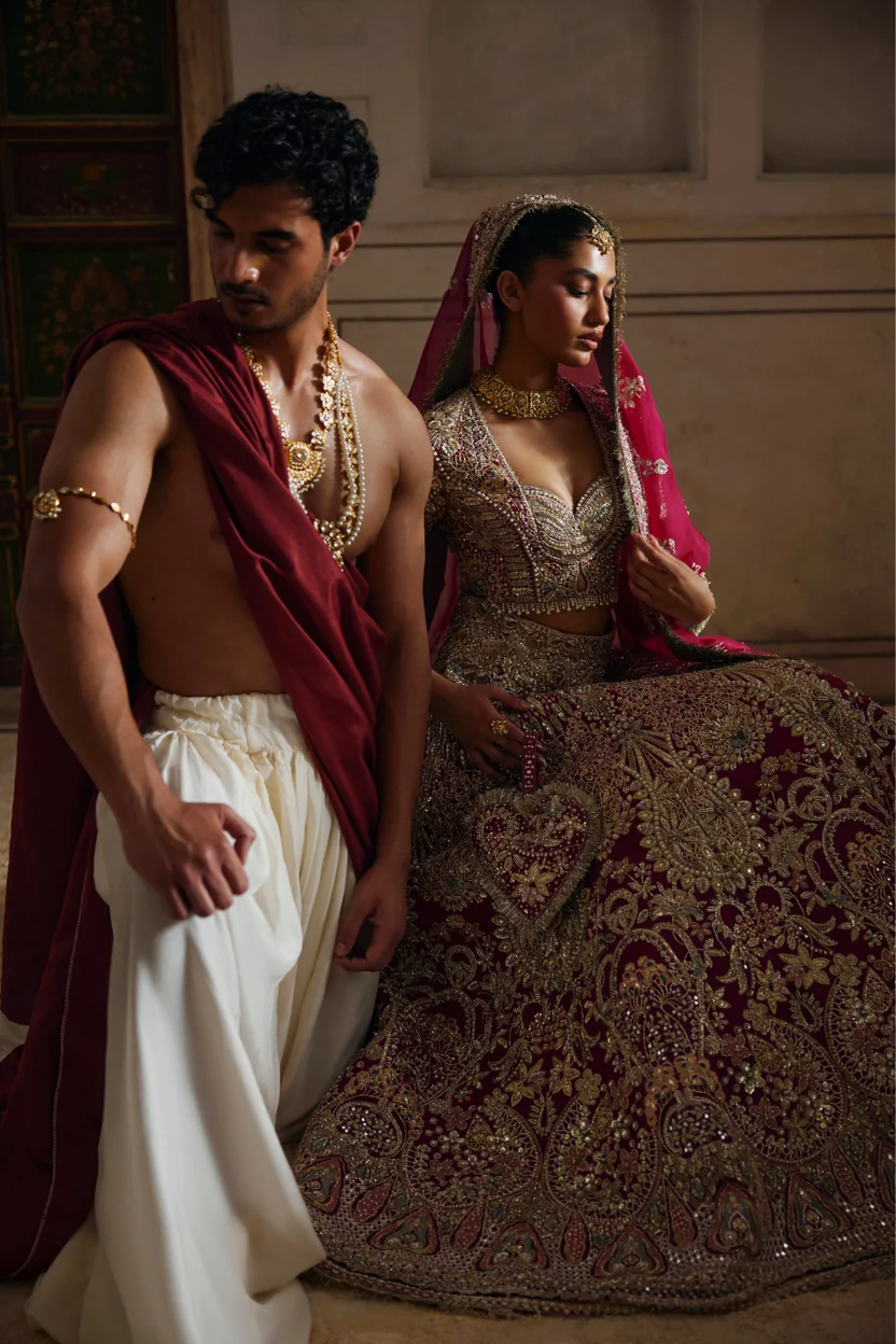 Matching deep red dupatta with scattered motifs and broad embroidered border