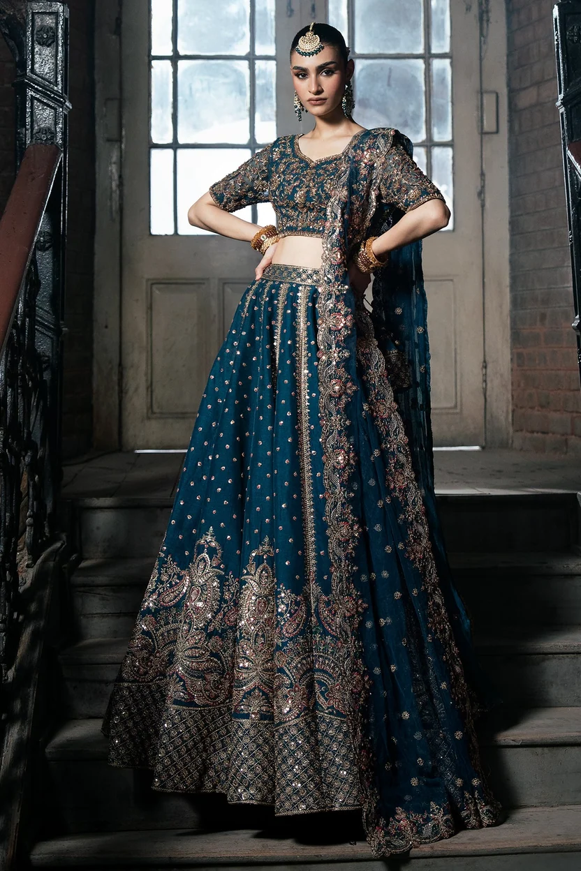 Mina Kashif Tabassum featuring intricate gold paisley motifs