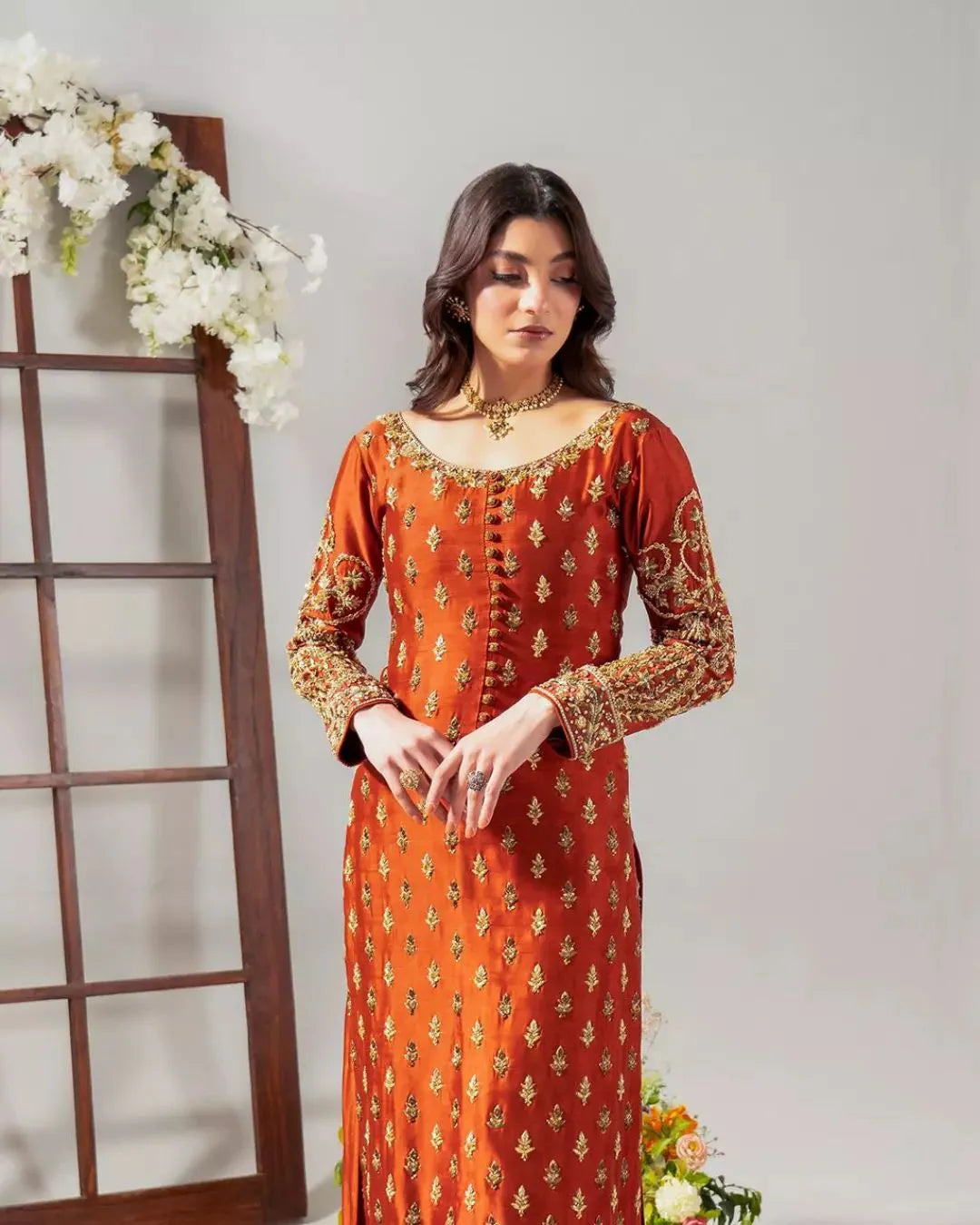 Tangerine suit with embroidered cotton net dupatta