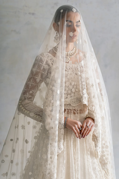 White formal dress with intricate bodice and sleeve work