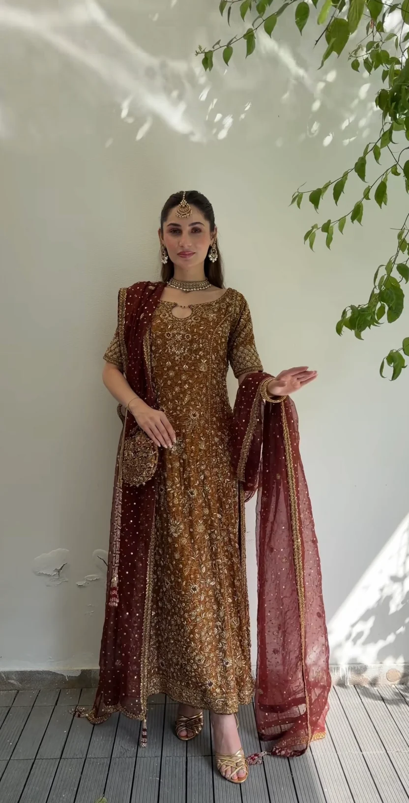 Floral embroidery and dabka embellishment on rust formal shirt